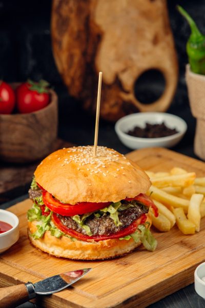 burger-bread-bun-with-potatoes-wooden-board